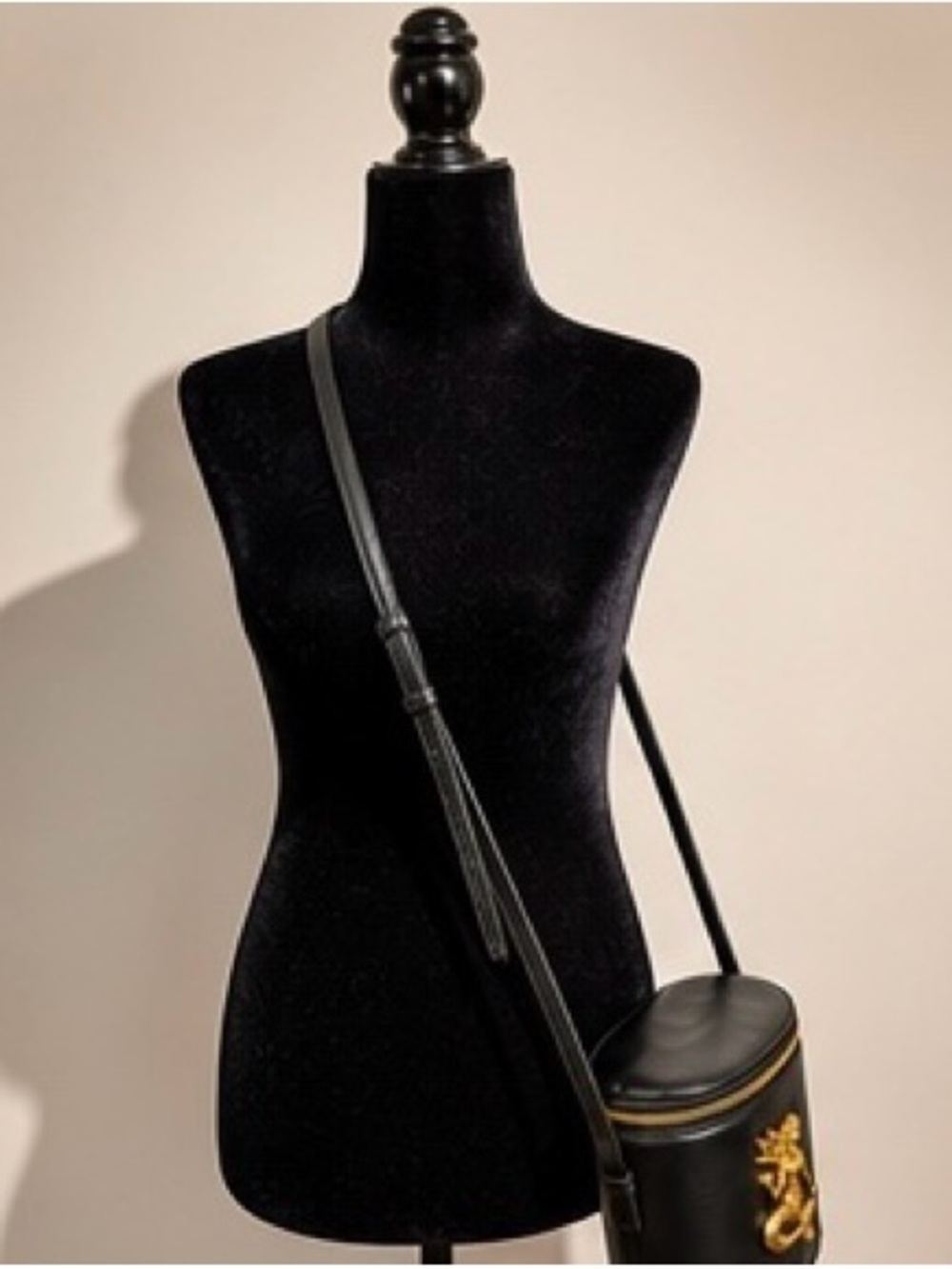 Black Cylindrical Crossbody Bag with Gold Mermaid Hardware